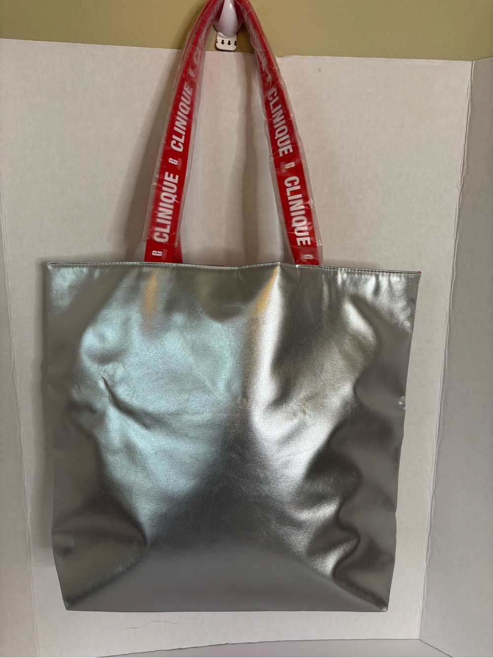 Clinique Metallic Silver Tote with Red Logo Straps